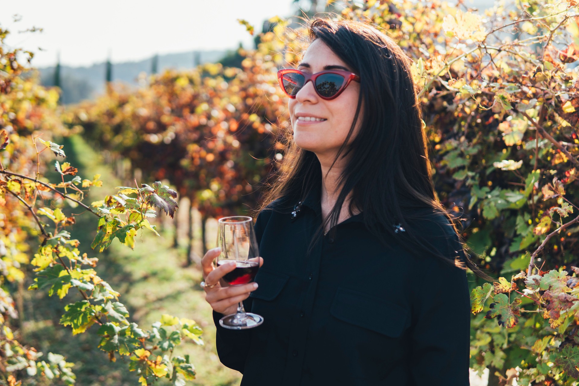 woman testing vine in the vineyard