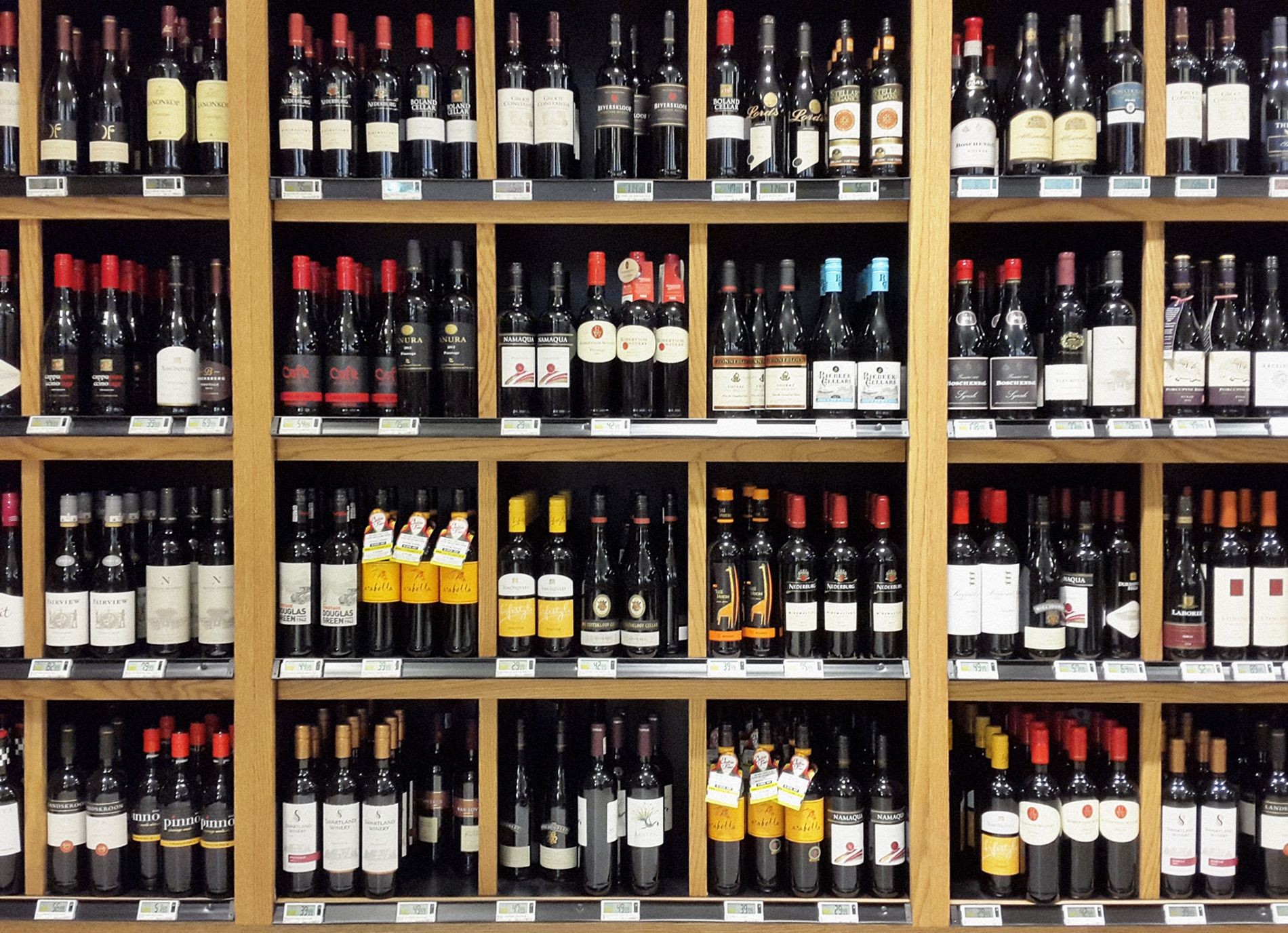 South African wines stacked on shelves in liquor store